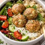 Delicious Greek chicken meatballs served with creamy homemade tzatziki sauce.
